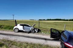 Two cars are seen at the scene, where eight-times rally world champion Sebastien Ogier crashed ahead of Rally Poland