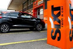 FILE PHOTO: The logo of German car rental company Sixt is seen in front of a branch office in Zurich