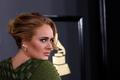 FILE PHOTO: Singer Adele arrives at the 59th Annual Grammy Awards in Los Angeles