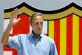 FILE PHOTO: Former Dutch international Neeskens waves in front of Barcelona's badge after his arrival at the Nou Camp stadium