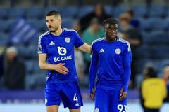 FILE PHOTO: Soccer-Leicester's 15-year-old debutant Monga wears blank shirt over gambling sponsor rule