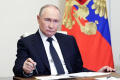 Russian President Putin chairs a meeting with members of the government via video link at a residence outside Moscow