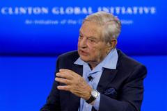 FILE PHOTO: Billionaire hedge fund manager George Soros speaks during a discussion at the Clinton Global Initiative's annual meeting in New York