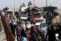Displaced Palestinians move southward after Israeli forces ordered residents of Gaza City to evacuate to the south