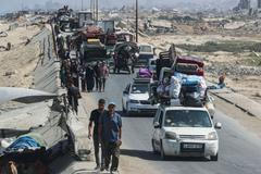 Displaced Palestinians, fleeing northern Gaza move southward, in the central Gaza Strip