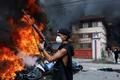 Protest against Monday's killing of 19 people after anti-corruption protests, in Kathmandu