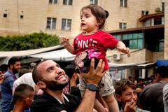 Obrazem: "Chvála Bohu, že je konec." Palestinci vítají začátek příměří