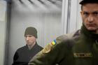 Russian soldier Kurashov, accused of committing a war crime, sits inside a cage during a court hearing expected to deliver a verdict in Zaporizhzhia