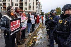 People take part in a protest organized by Portland Contra Deportaciones at the ICE facility in Portland