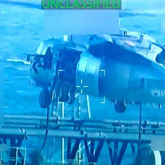 U.S. forces abseil onto an oil tanker during its seizure by the United States off the coast of Venezuela