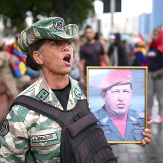Government supporters march to commemorate the Battle of Santa Ines, in Caracas