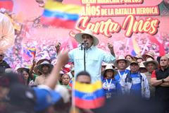 Government supporters march to commemorate the Battle of Santa Ines, in Caracas