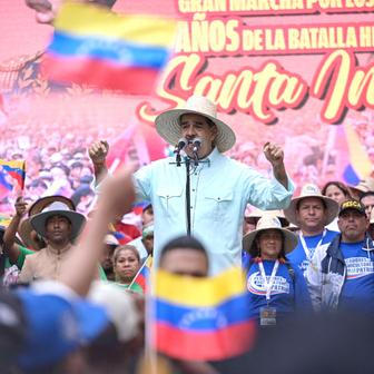 Government supporters march to commemorate the Battle of Santa Ines, in Caracas