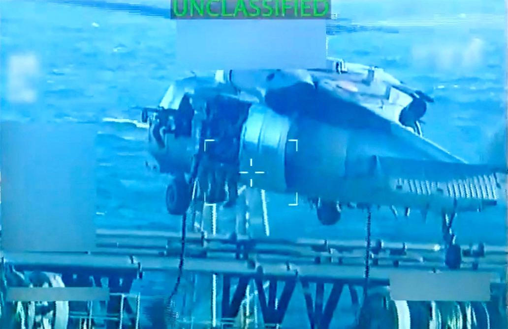 U.S. forces abseil onto an oil tanker during its seizure by the United States off the coast of Venezuela