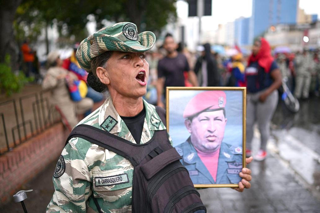 Government supporters march to commemorate the Battle of Santa Ines, in Caracas