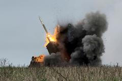 FILE PHOTO: Ukrainian servicemen fire a Multiple Launch Rocket System towards Russian troops near the frontline town of Pokrovsk