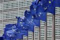 FILE PHOTO: FILE PHOTO: European Union flags flutter outside the EU Commission headquarters in Brussels