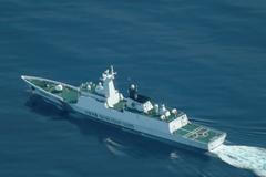 FILE PHOTO: An aerial view of a China Coast Guard ship navigating near the disputed Scarborough Shoal, as Philippine Coast Guard aircraft carrying journalists patrols the area