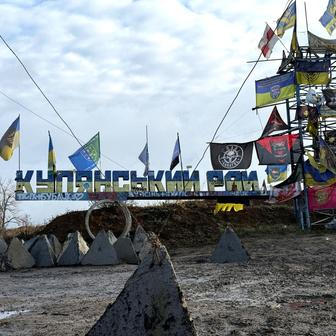A road sign reads 'Kupiansk region’, near the frontline town of Kupiansk