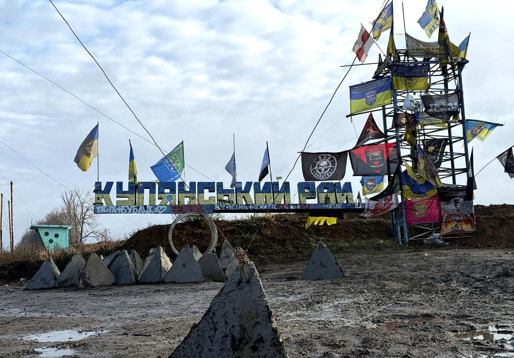 A road sign reads 'Kupiansk region’, near the frontline town of Kupiansk