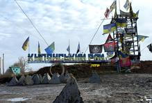 A road sign reads 'Kupiansk region’, near the frontline town of Kupiansk