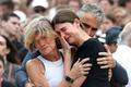 People pay respects at to victims of a shooting during a Jewish holiday celebration at Bondi Beach, in Sydney