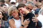 People pay respects at to victims of a shooting during a Jewish holiday celebration at Bondi Beach, in Sydney