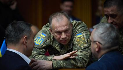 Commander in Chief of the Ukrainian Armed Forces Colonel General Syrskyi speaks with lawmakers during a parliament session in Kyiv
