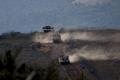 FILE PHOTO: Israeli military vehicles manoeuvre along the Israel-Lebanon border as seen from northern Israel