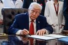 U.S. President Trump signs executive orders at the Oval Office, in Washington