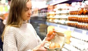 Woman,Chooses,Chicken,Eggs,In,A,Farm,Food,Store.,Food