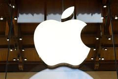 FILE PHOTO: Apple logo at an Apple store in Paris