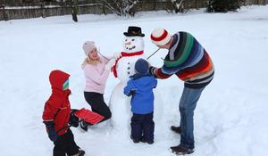 Family making a snowman