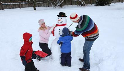 Family making a snowman