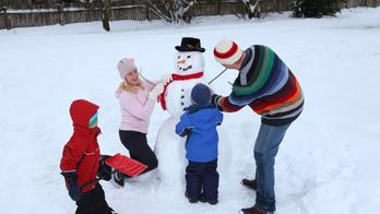 Family making a snowman