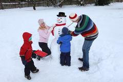 Family making a snowman