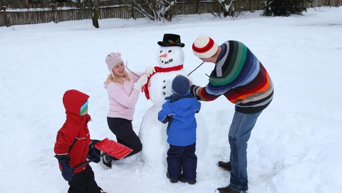 Family making a snowman