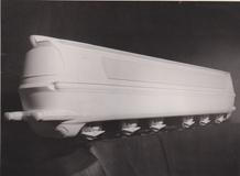 Po Františku Kardausovi se návrhářského pera ujal architekt Otakar Diblík, který zcela přepracoval čelní partie.