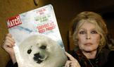 FILE PHOTO: Former French actress Brigitte Bardot displays a 1969 copy of french magazine "Paris Match" showing ..