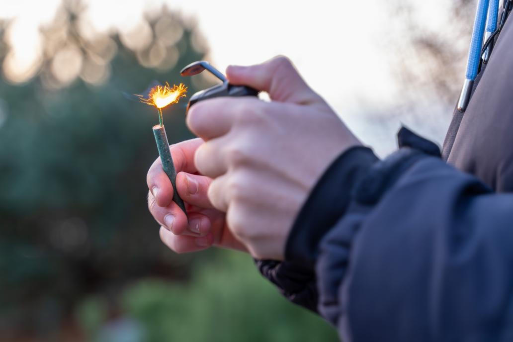 Lighting,A,Firecracker,With,A,Lighter,?,Close-up,Hands