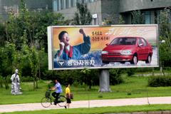 Jeden z billboardů v Pchongjangu, který zobrazuje automobil Pyeonghwa Hwiparam.