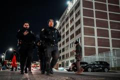 NYPD officers patrol outside of the Metropolitan Detention Center in Brooklyn , New York