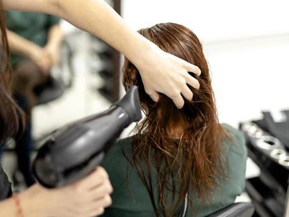Professional,Hairdresser,Using,Modern,Diffuser,Hair,Dryer,To,Dry,And