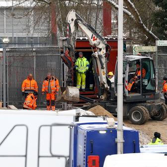 Men work on a construction site of combined heat and power plant Lichterfelde in Berlin