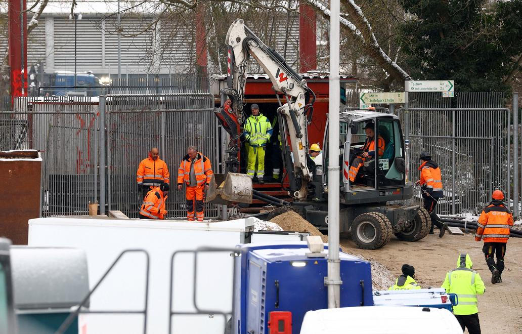 Men work on a construction site of combined heat and power plant Lichterfelde in Berlin