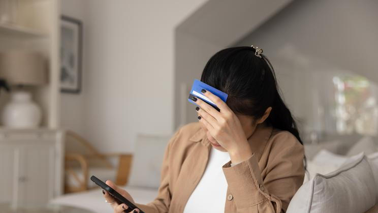 Tired,Upset,Young,Asian,Bank,Client,Getting,Money,Problems,,Finding