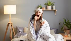Indoor,Shot,Of,Sleepy,Woman,Wrapped,In,A,Blanket,After
