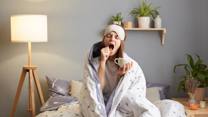 Indoor,Shot,Of,Sleepy,Woman,Wrapped,In,A,Blanket,After