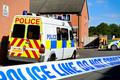British,Police,Vehicles,At,Cordoned,Off,Crime,Scene,In,A