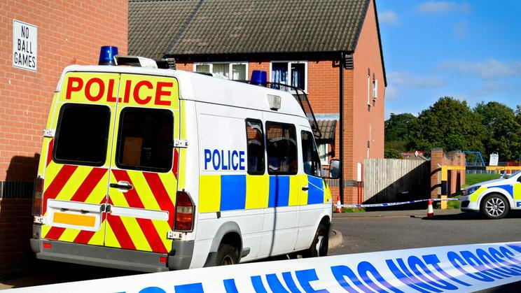 British,Police,Vehicles,At,Cordoned,Off,Crime,Scene,In,A